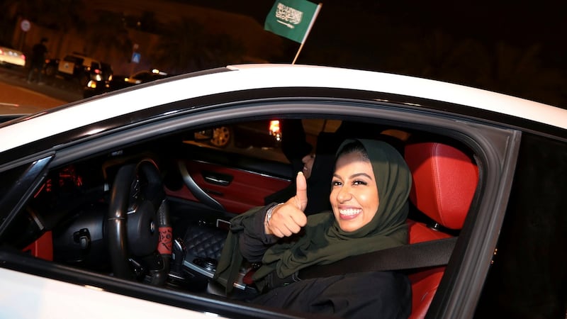 A Saudi woman celebrates as she drives her car in her neighborhood, in Al Khobar, Saudi Arabia. Photograph: Hamad I Mohammed/Reuters