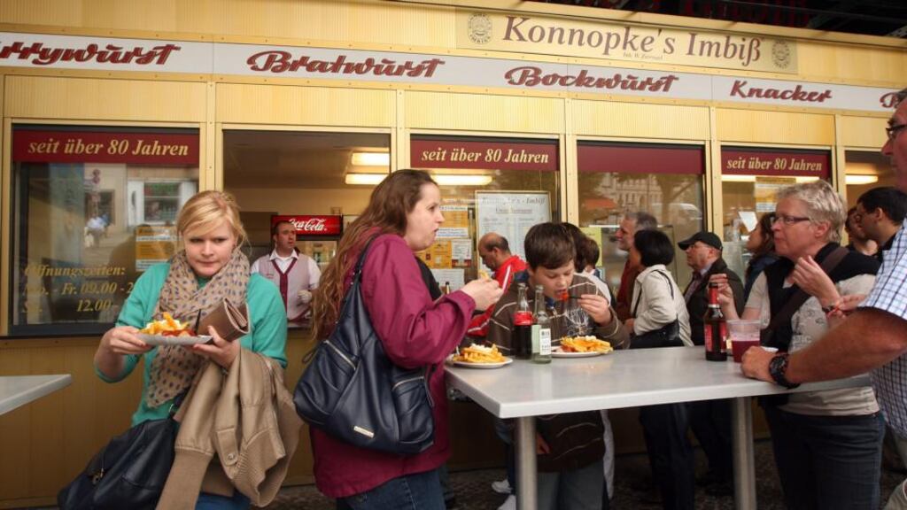 Currywurst sausages and fries at Konnopke’s in Berlin. Photograph: Adam Berry/Getty Images