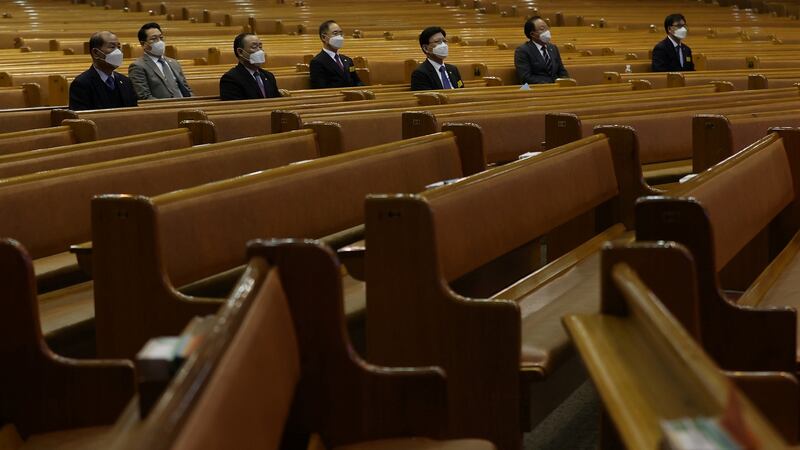 Christian faithfuls wearing masks to prevent contacting the coronavirus sit during a service at a church in Seoul, South Korea, on Sunday. Photograph:Yonhap/Reuters