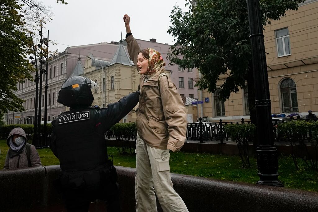 Police detain a demonstrator in Moscow. Photograph: AP