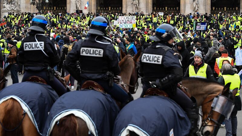 Protesters gather at Place de l’Opéra during a ‘yellow vest’ demonstration in Paris, France. Photograph: Jeff J Mitchell/Getty Images