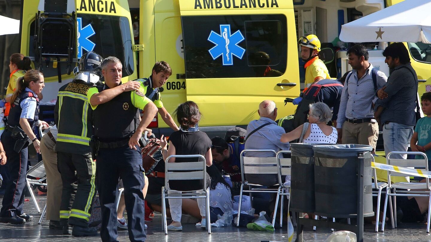 Injured people are treated in Barcelona. Photograph: Oriol Duran/AP
