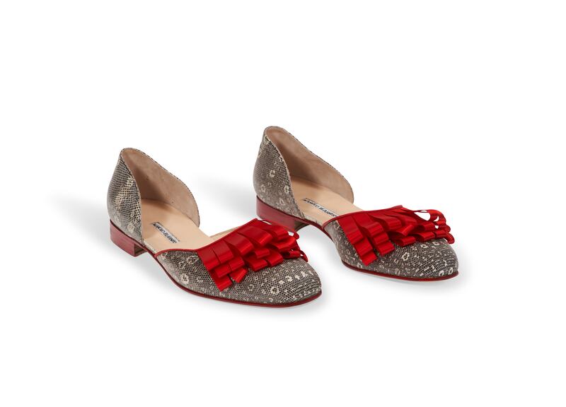 A pair of reptile skin and red silk embellished evening shoes by Manolo Blahnik