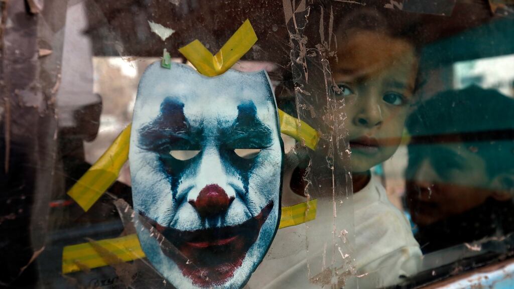 Children on  a mini truck with a Joker cutout as the Covid-19 pandemic rages in Sanaa. Photograph: Yahya Arhab