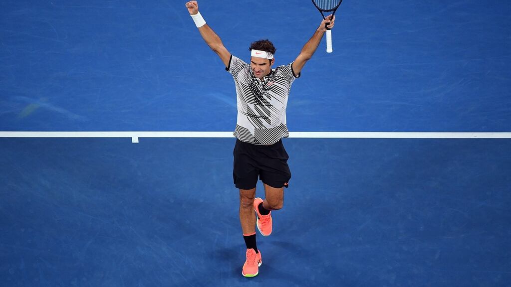 Roger Federer of Switzerland celebrates after winning his men’s singles quarter-final match against Mischa Zverev of Germany at the Australian Open. Photo: Dean Lewins/EPA
