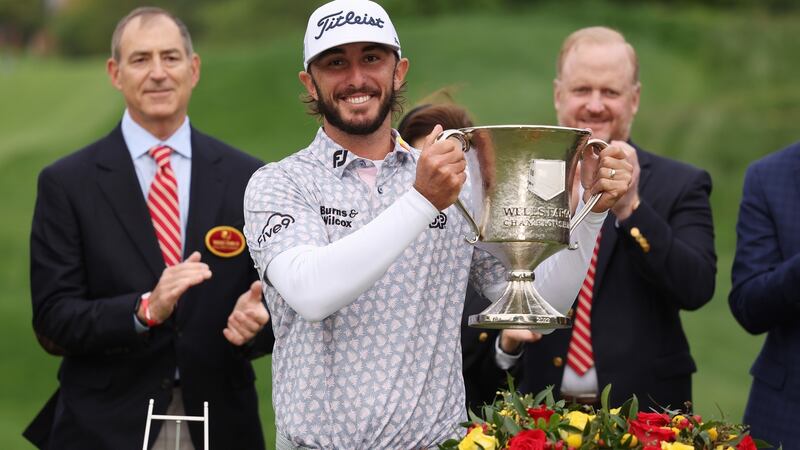 Max Homa celebrates with the trophy after winning the Wells Fargo Championship at TPC Potomac in Maryland. Photograph: Gregory Shamus/Getty Images