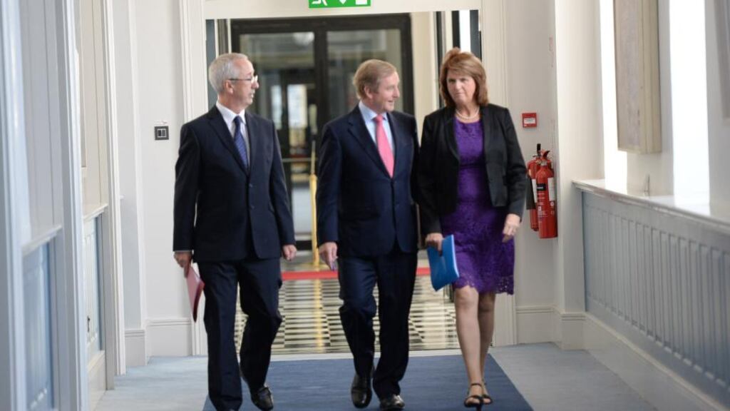 Taoiseach Enda Kenny, Tánaiste Joan Burton and Kevin Humphreys arriving for the launch of the Pathways to Work strategy at Government Buildings yesterday. Photograph: Cyril Byrne