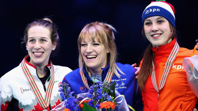 Elise Christie celebrates 1000m gold in Rotterdam with Canada’s silver medallist Marianne St-Gelais (L) and Suzanne Schulting of the Netherlands who took bronze. Photograph: Dean Mouhtaropoulos/Getty