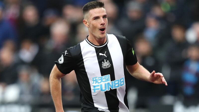 Ciaran Clark celebrates scoring Newcastle United’s first goal against West Ham United. Photograph: Alex Pantling/Getty Images