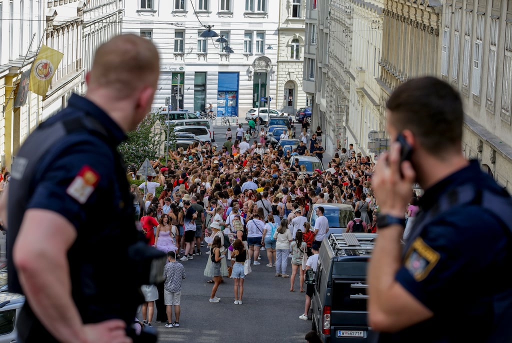Police look on as Taylor Swift fans gather in Vienna following the cancellation of her concerts this week. Photograph: Heinz-Peter Bader