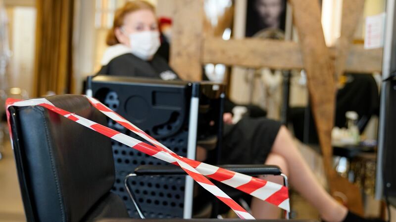 A chair is taped up in a salon in Speyer, Germany. Hairdressers reopened on Monday but with strict social distancing rules in place. Photgraph: Ronald Wittek/EPA