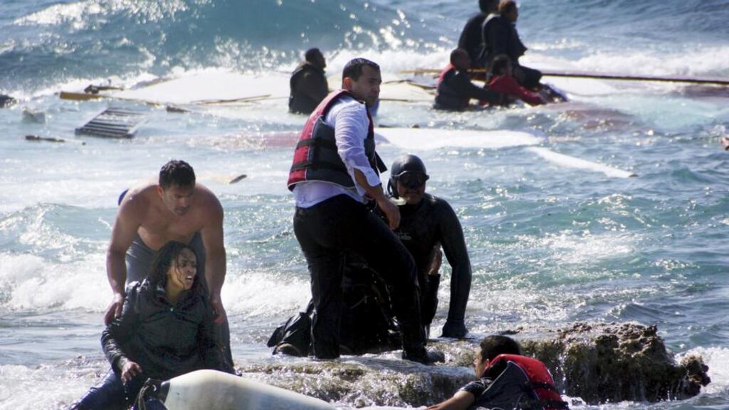 Migrants, who are trying to reach Greece, are rescued by members of the Greek Coast guard and locals near the coast of Rhodes. Photograph: Eurokinissi/Reuters