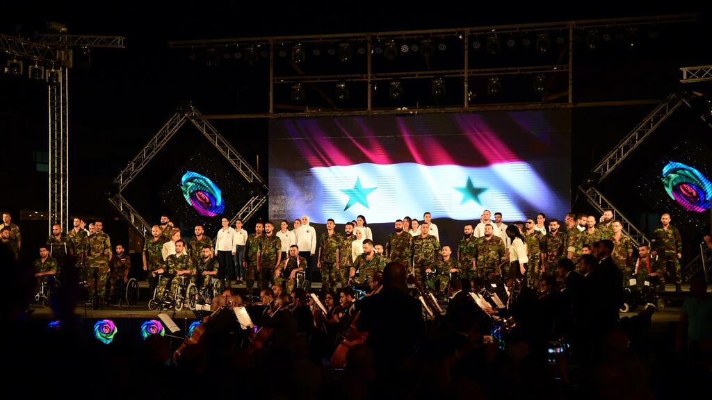 Injured Syrian army members receive honours during the opening of the Damascus International Fair. File photograph: Youssef Badawi/EPA