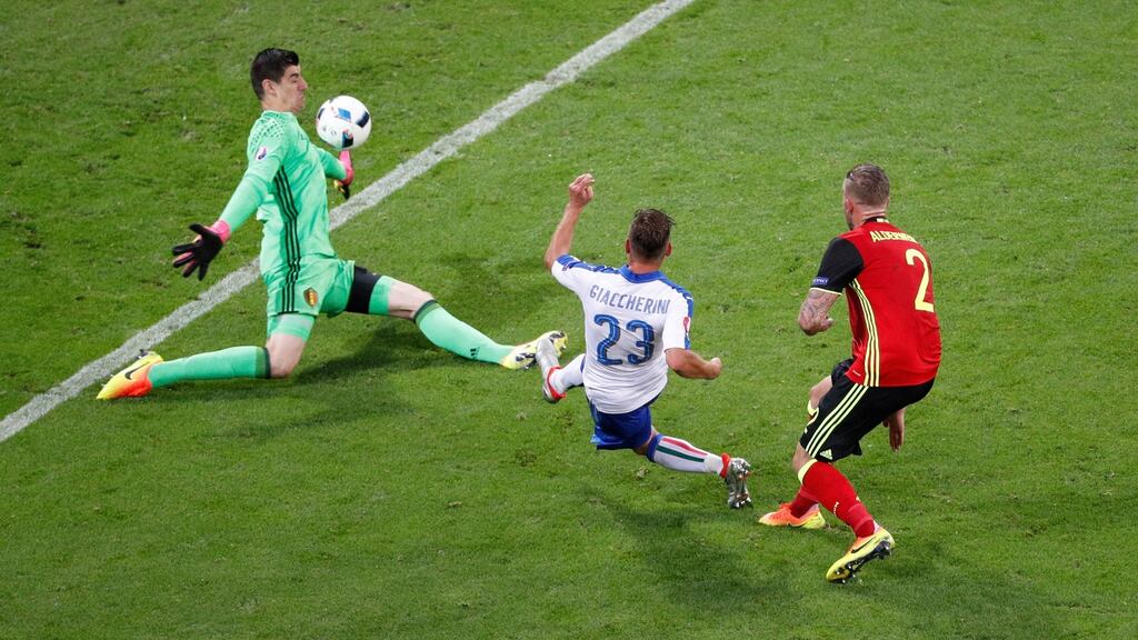 Italy’s Emanuele Giaccherini slides the ball past belgium goalkeeper Thibaut Courtois to open the scoring in the Euro 2016 Group E game in Lyon. Photograph: Max Rossi/Reuters/Livepic