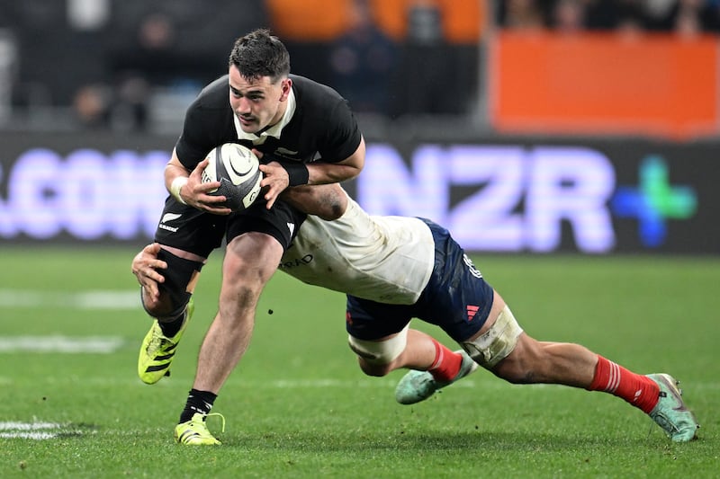 Will Jordan of New Zealand passes during the International Test match between New Zealand All Blacks and France. Photograph: Joe Allison/Getty