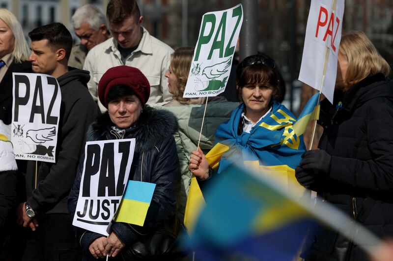 Demonstrators hold Spanish-language signs urging 'Peace' during a protest to mark one year since Russia's invasion of Ukraine, in Madrid, Spain, on Sunday, February 26th, 2023. Photograph: Pierre-Philippe Marcou/AFP/Getty