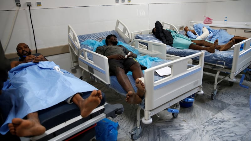 Wounded migrants lie in hospital after the air strike on Tajoura detention centre. Photograph: Ismail Zitouny/Reuters