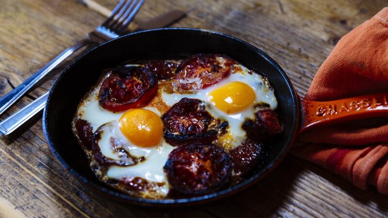 Blackened tomatoes with chorizo and egg. Photograph: Emma Jervis