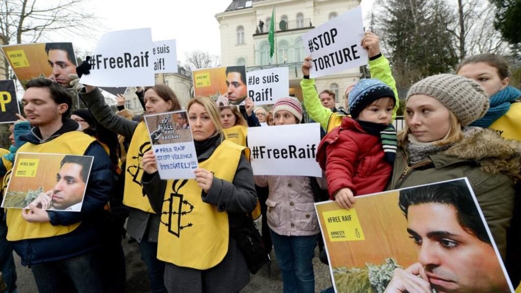 People take part in an Amnesty International protest in front of the Saudi Embassy in Vienna, on Friday, against the flogging of Saudi blogger Raif Badawi. Photograph: EPA