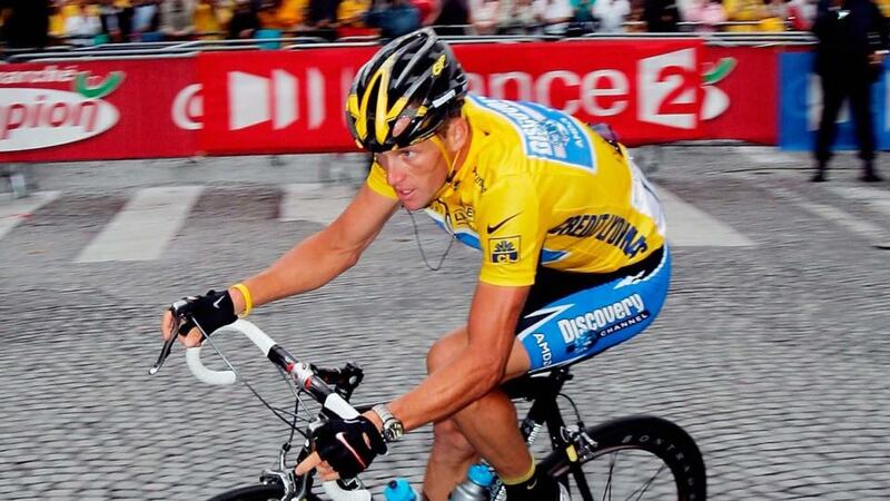 Lance Armstrong passes the Arc de Triomphe in Paris on his way to winning a seventh consecutive Tour de France