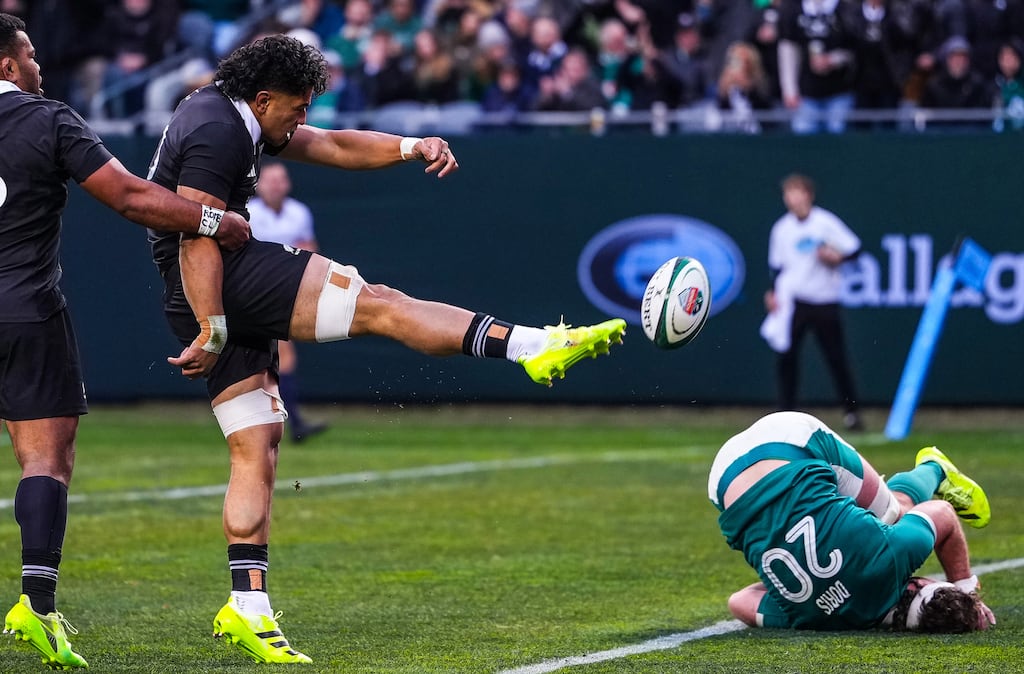 Wallace Sititi celebrates scoring New Zealand's their third try as Caelan Doris of Ireland falls to the surface. Photograph: Robert Alam/Inpho/Photosport