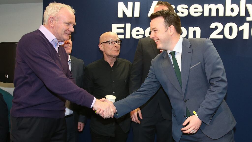 Martin McGuinness (Sinn Fein) shakes hands with Colum Eastwood (SDLP) as Eamonn McCann (People Before Profit) looks on at the Foyle Arena in Derry. Photograph: Niall Carson/PA