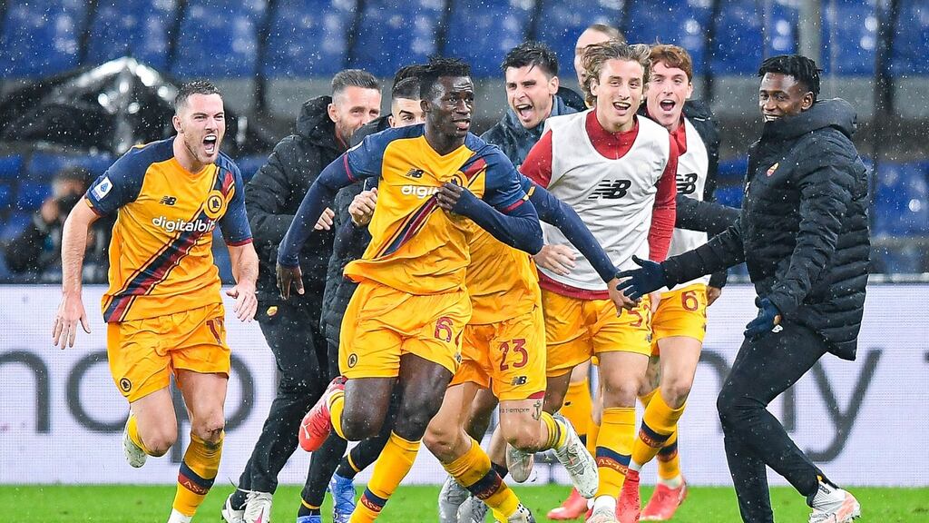 Roma’s Felix Afena-Gyan  celebrates with teammates after scoring his first of two late goals against Genoa. Photograph:  EPA/Simone Arveda
