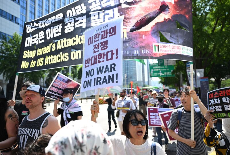 Demonstrators march with placards condemning the US attacks on Iran during a protest in Seoul, South Korea, on Sunday. Photograph: Jung Yeon-je/AFP via Getty Images