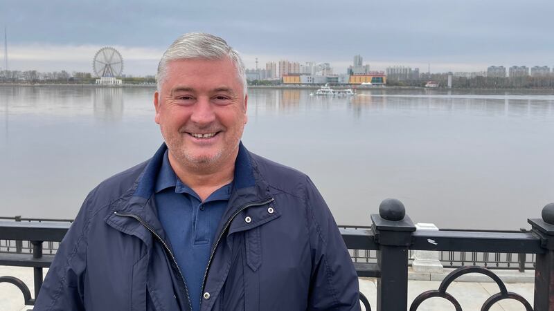 Boris Beloborodov, chairman of the Russian-Chinese Friendship Society in the Amur region, stands in Blagoveshchensk by the Amur river, looking out towards Heihe in China. Photograph: Daniel McLaughlin