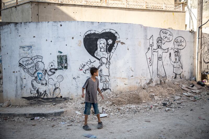 A boy on the streets of Jenin refugee camp, where the Israeli military regularly carries out raids. Photograph: Sally Hayden