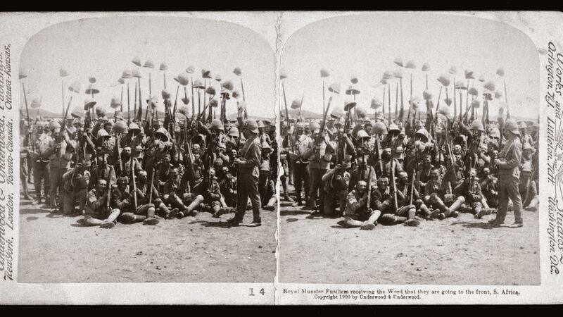 A contingent of Royal Munster Fusiliers raise their pith helmets in a show of jubilation at the news they are to be sent into action. The regiment served in South Africa from 1900 until 1902. Photograph: SSPL/Getty Images