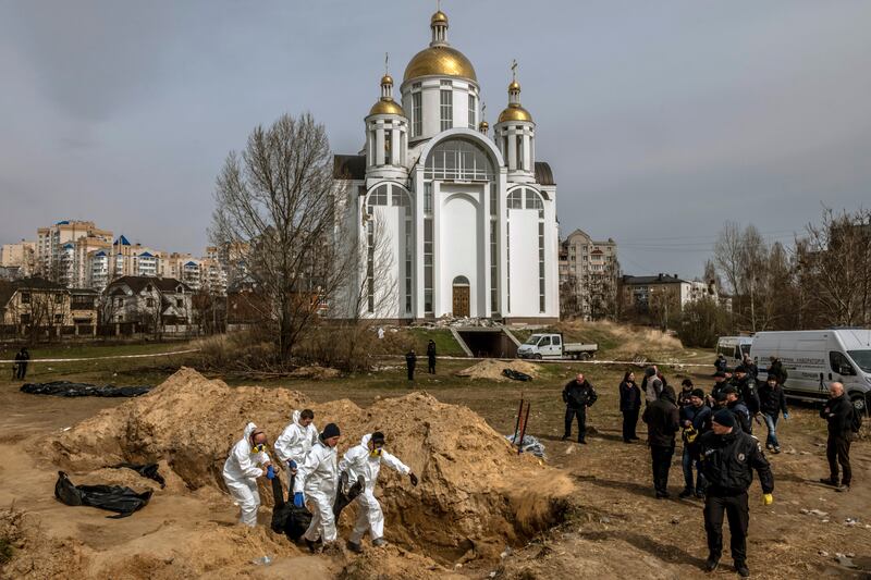 Bodies being exhumed from a mass grave in front of Bucha's St Andrew’s Church on April 8th, 2022 following Russian occupation. Photograph: Daniel Berehulak/The New York Times