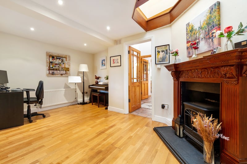 The sittingroom opens on to a second reception room through double doors. Photograph: Keith Owens