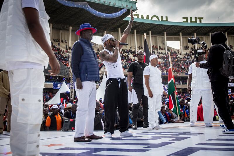 Kenyan presidential candidate Raila Odinga stands with Tanzanian musician Diamond Platnumz at a rally in central Nairobi on Saturday. Photograph: Sally Hayden