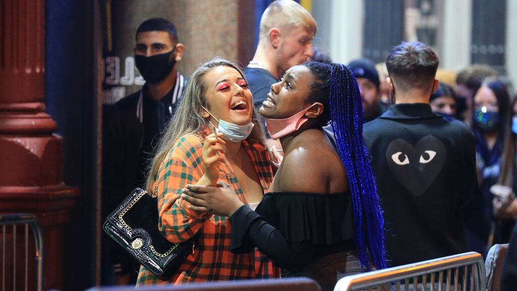Revellers enjoy a night out in the centre of Liverpool, England, where new Covid-19 restrictions are set to be introduced in the coming days. Photograph: Lindsey Parnaby / AFP