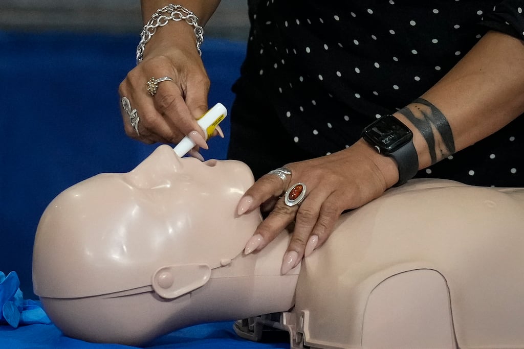 An official in Washington, DC demonstrates how to administer a Naloxone nasal spray to reverse an opioid overdose. Photograph: Drew Angerer/Getty Images