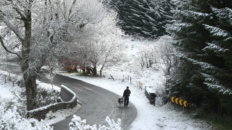 A walker enjoys the snow in the mountains near Killakee, to the south east of Dublin. Photograph : Niall Carson/PA Wire