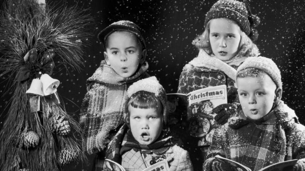 Christmas carolling: fairy tale of New York or bleak midwinter? Photograph: Lambert/Getty