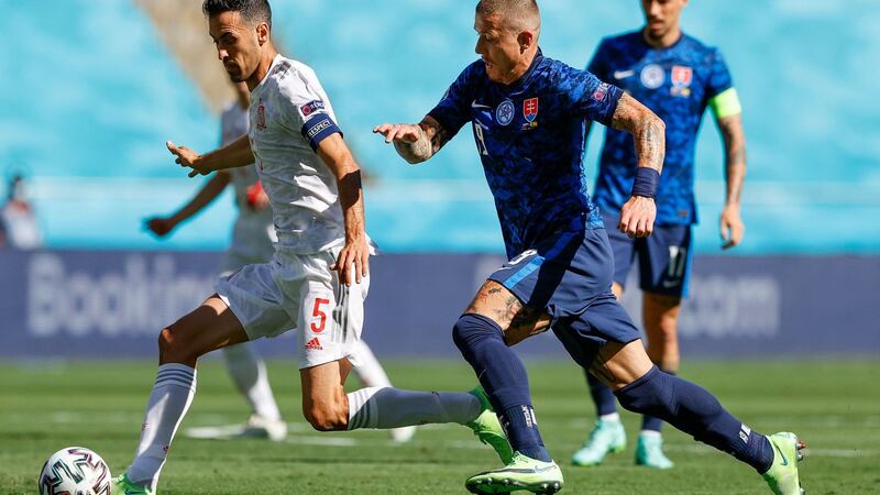 Spain’s Sergio Busquets is challenged by Slovakia’s Juraj Kucka during the game at La Cartuja Stadium in Seville. Photograph: Marcelo del Pozo/AFP via Getty Images