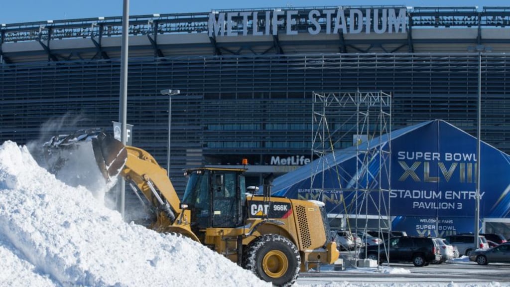Snow is cleared from the car park of MetLife Stadium, East Rutherford, New Jersey, which hosts the Super Bowl on Sunday. Photograph: Fred R Conrad/The New York Times