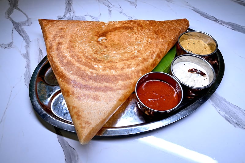 The gunpowder dosa arrives, golden, brittle and utterly delicious from the heat of the spicing. Photograph: Bryan Meade