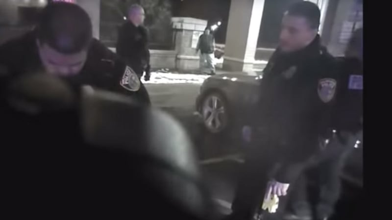 A still image taken from a body camera video made available by the Milwaukee Police Department reportedly shows a Milwaukee police officer (right) holding a discharged taser that was used on  Sterling Brown on the night he was tasered and handcuffed during his arrest. Photograph: EPA