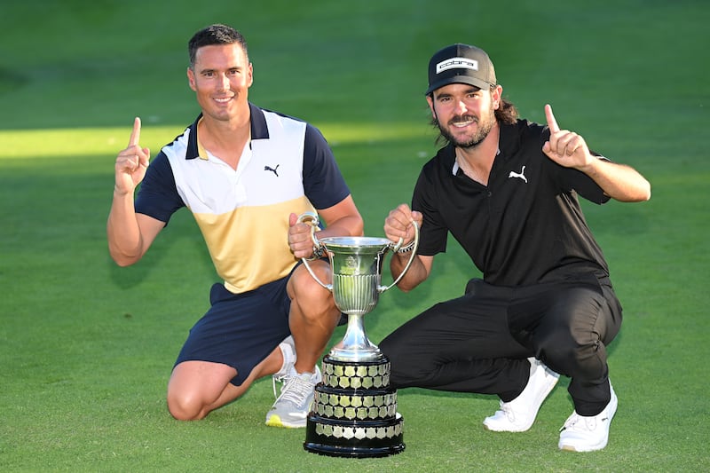 Angel Hidalgo and his caddie with the trophy after his victory in the Spanish Open at Club de Campo Villa de Madrid. Photograph: Stuart Franklin/Getty Images