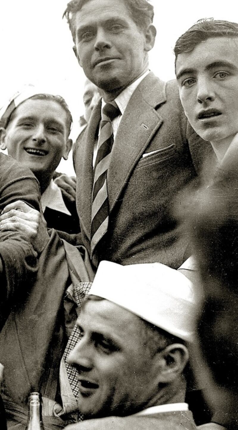 Christy Ring surrounded by fans after the Cork v Tipperary Munster Hurling Final in  Limerick on July 13th, 1952. Photograph from Echoes of the Past – Where We Sported and Played