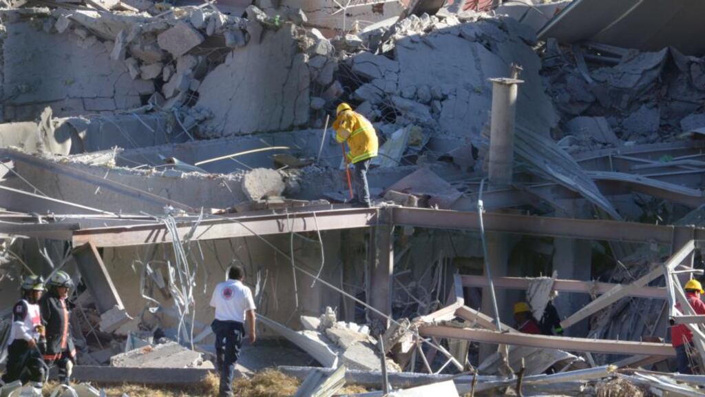Rescuers work amid the wreckage caused by an explosion in a hospital in Cuajimalpa, Mexico City. Photograph: Getty Images