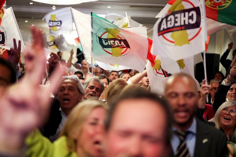Supporters of far-right party Chega celebrate at their headquarters in Lisbon. Photograph: Andre Dias Nobre/AFP via Getty Images