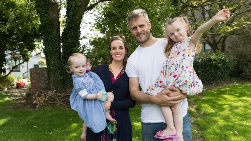 Padraig and Julie Neylon with young Theola and Kara at home on Frances Street, Kilrush. Photograph: Eamon Ward