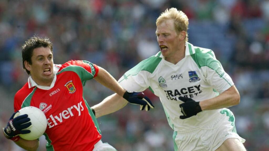 Liam McBarron of Fermanagh (right) in action against Mayo’s Fergal Kelly in the All-Ireland SFC semi-final replay in August 2004. Photograph: Billy Stickland/Inpho