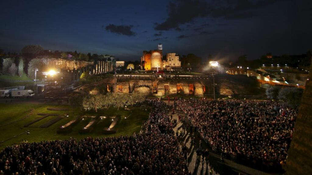 Faithful wait for the start of the “Via Crucis” (Way of the Cross) procession, which commemorates the crucifixion of Jesus Christ. It was led by Pope Francis at the Colosseum in Rome on Good Friday. Photograph: Stefano Rellandini/Reuters