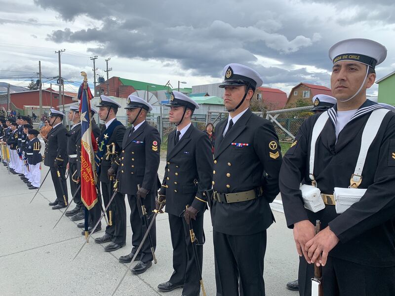 Officers and ratings of the Chilean Navy based on Isla Navarino stand to attention on Plaza O'Higgins, marking the 69th anniversary of the founding of Puerto Williams. Photograph: Peter Murtagh